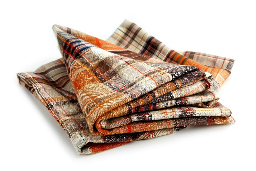 Folded napkins with plaid clothing blanket apparel.