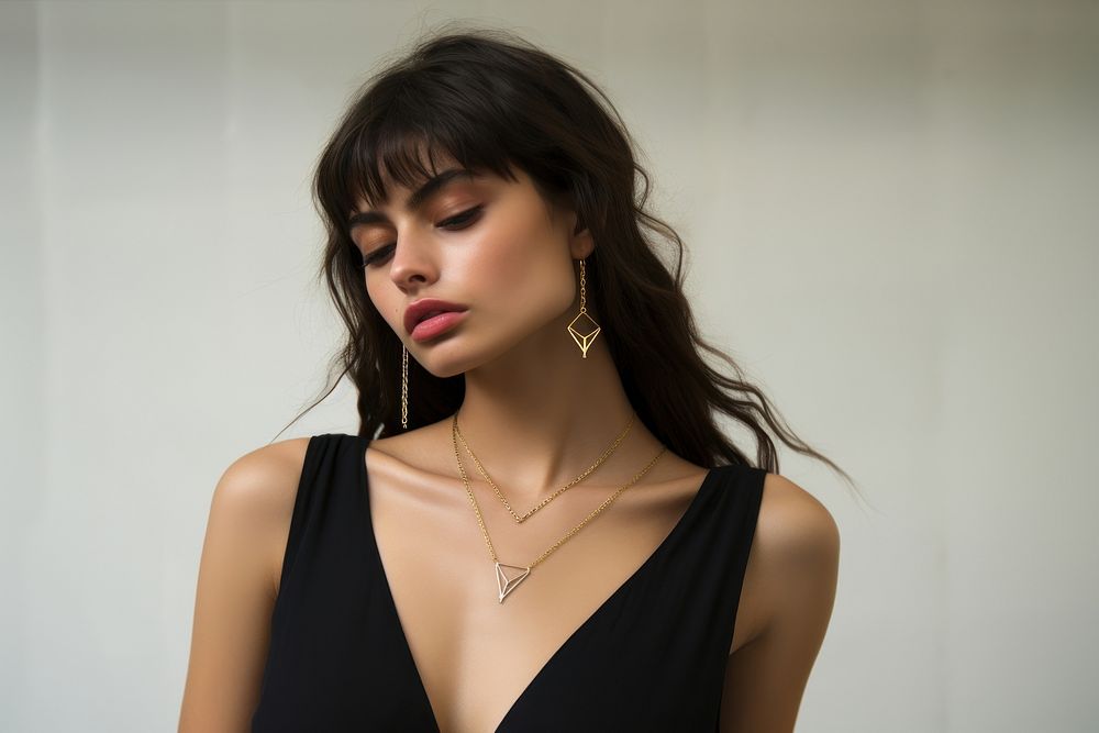 Model brunette in modern gold metal necklace chain photo accessories photography.