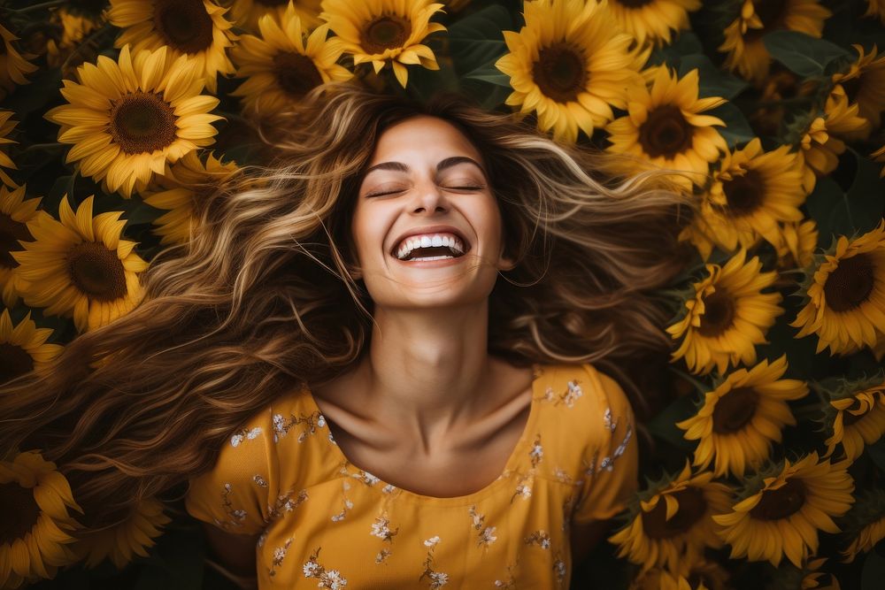 Woman with sunflowers in her hair laughing blossom person.
