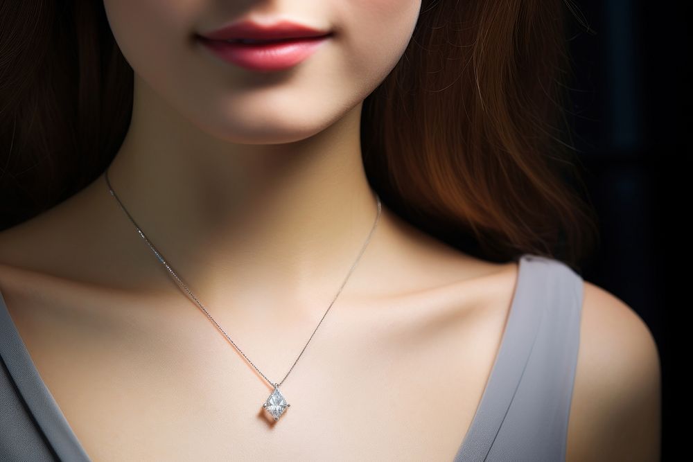 Young woman wearing shiny diamond pendant accessories accessory necklace.