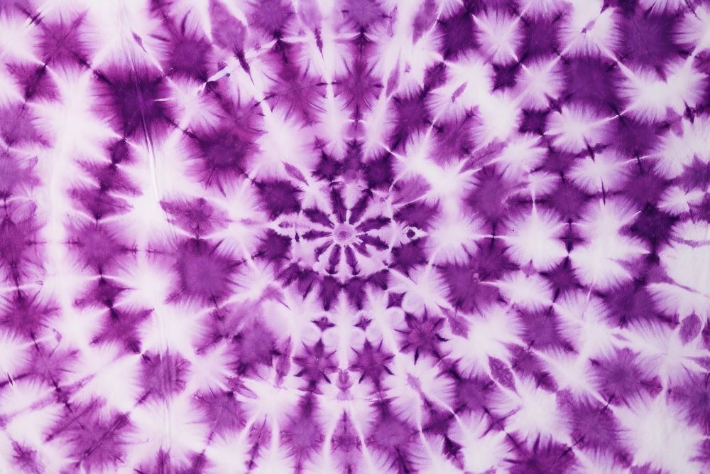 Abstract tie dyed shibori pattern texture purple velvet.