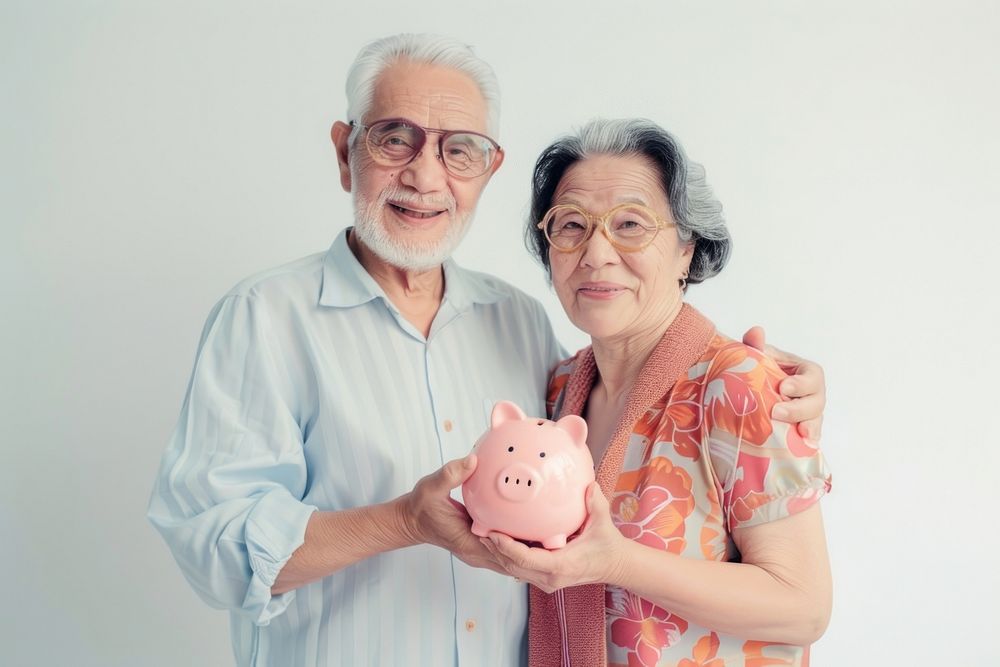 Cute senior couple holding piggy bank accessories photography accessory.