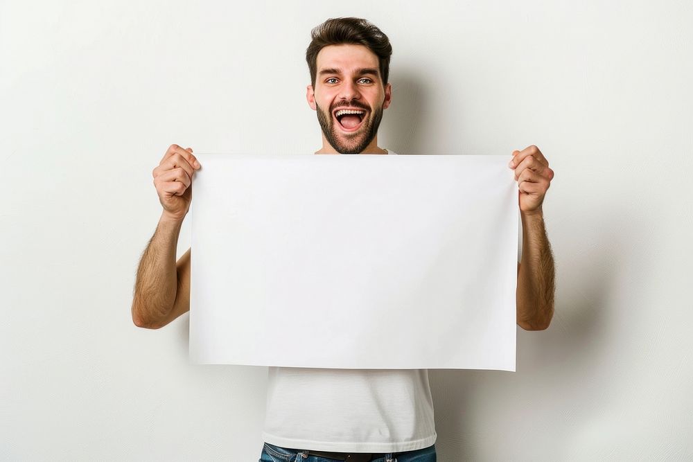Happy man holding blank poster portrait adult white.