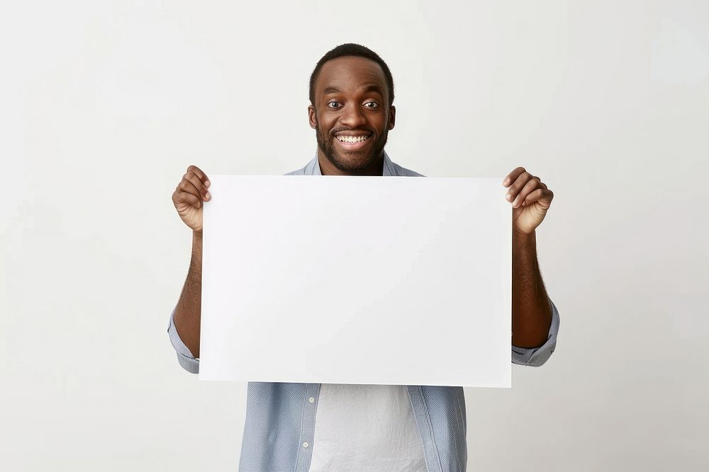 Happy man holding blank poster portrait adult photo.