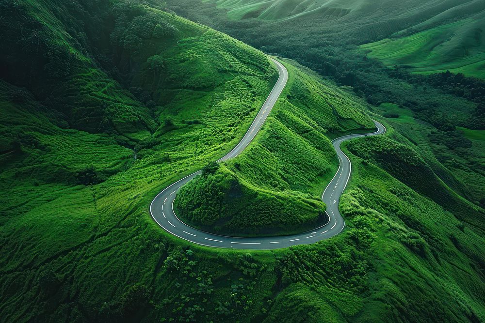 The curve of a winding road outdoors mountain nature.