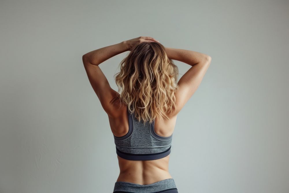 Bob hair blonde caucasian woman stretching after yoga back person female.