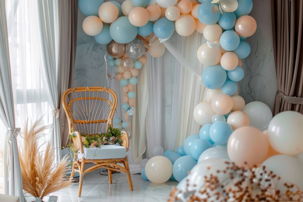 A room decorate for baby event with balloons furniture chair party.