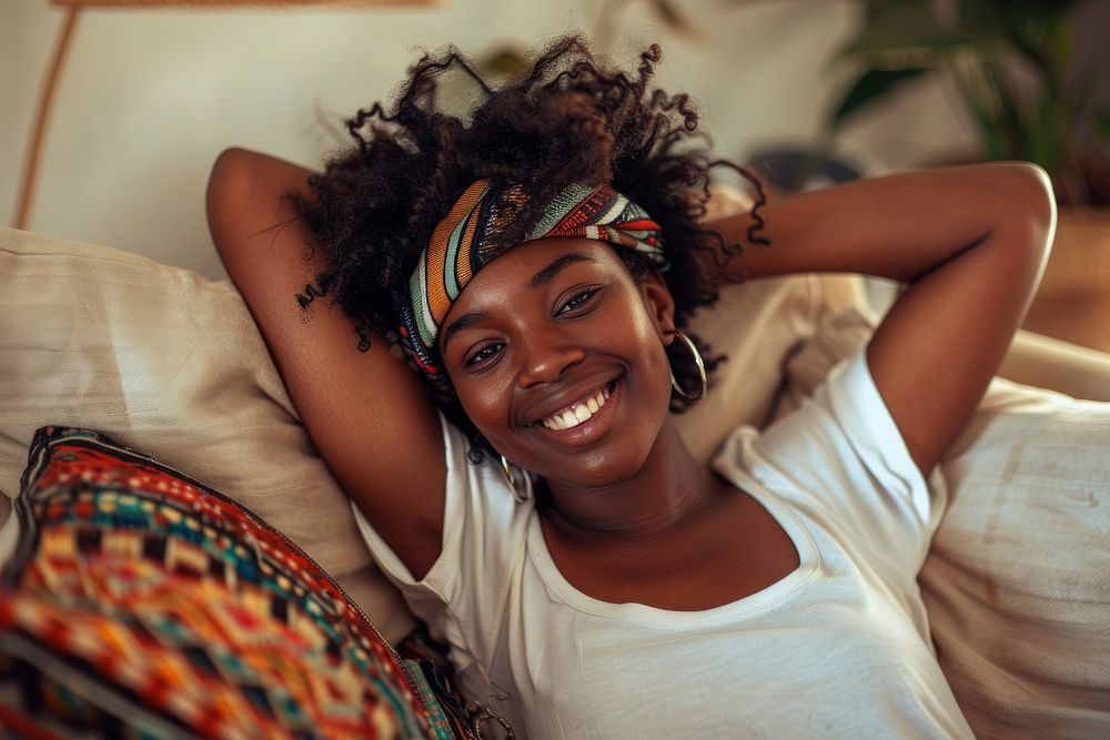 Young african american woman relax on the sofa at home photo photography portrait.