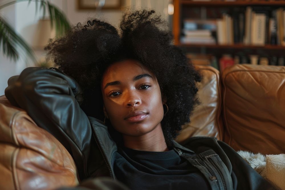 Young african american woman relax on the sofa at home person female human.