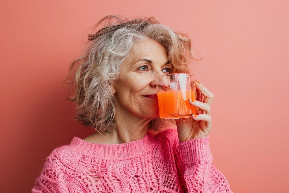 Mature woman drinking clothing knitwear.