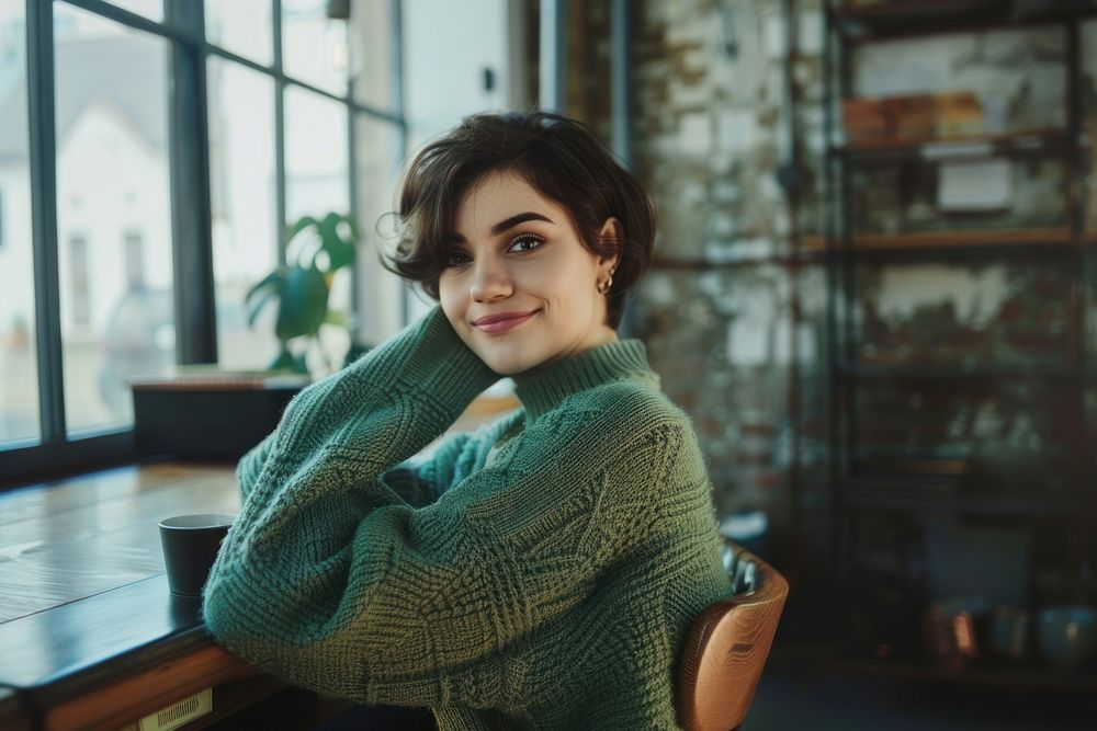 Short hair woman in green mint weater turn sideway to smile at camera clothing knitwear apparel.