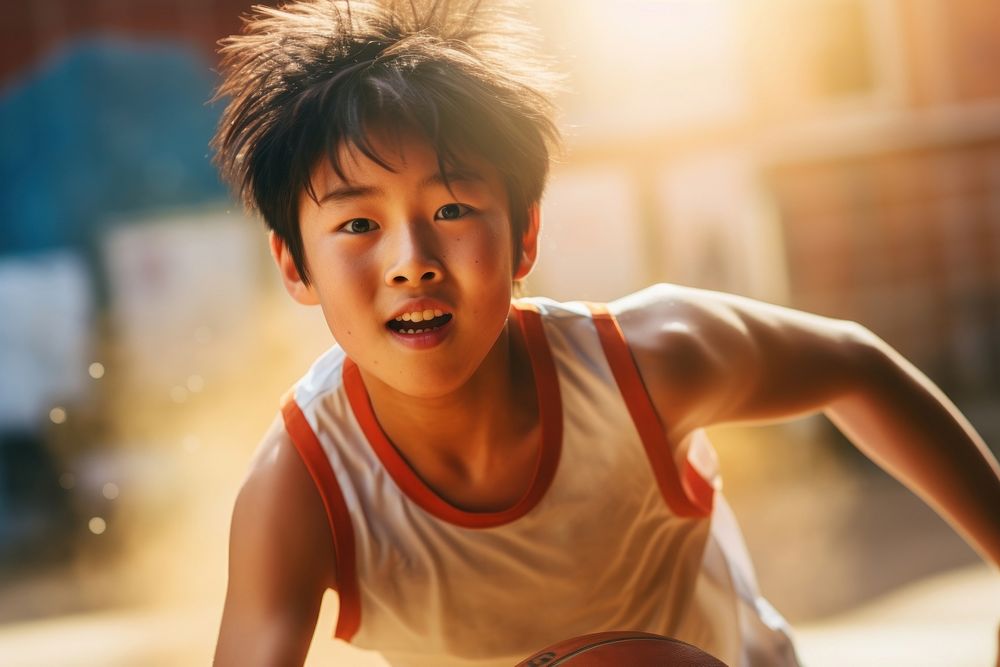 Sout east asian boy athletic basketball playing basketball sweating.
