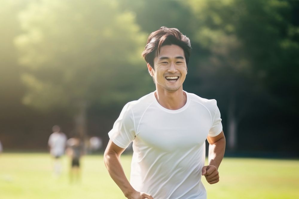 Sout east asian student man athletic laughing running jogging.