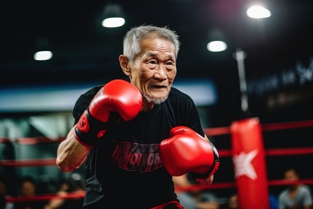 Sout east asian senior man athletic boxing clothing punching.