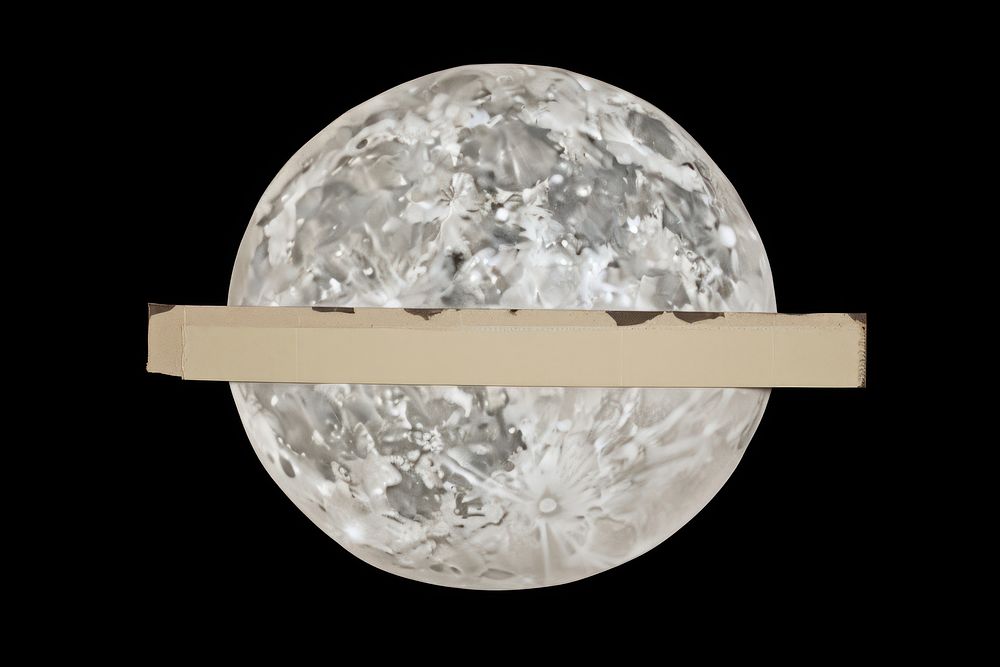 Adhesive tape is stuck on a moon ephemera collage astronomy darkness lighting.