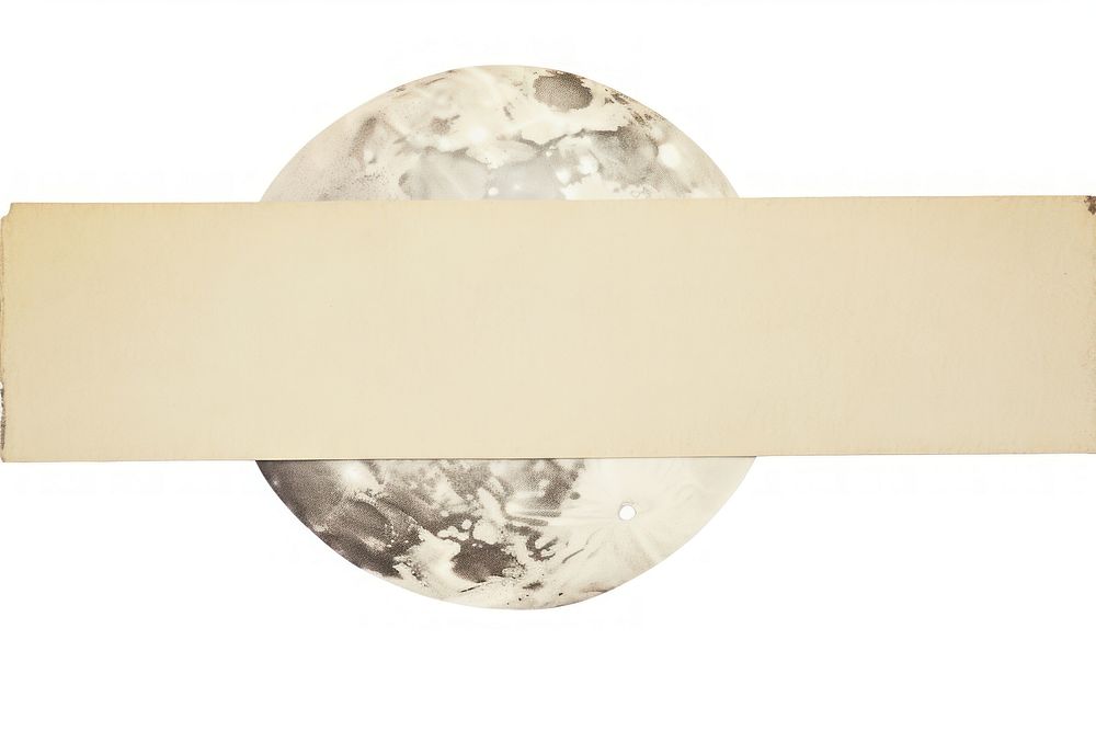 Adhesive tape is stuck on a moon ephemera collage paper white background rectangle.