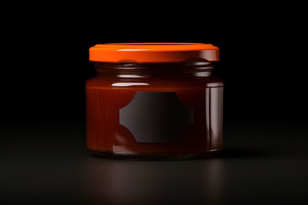 Orange jam jar mockup bottle food black background.