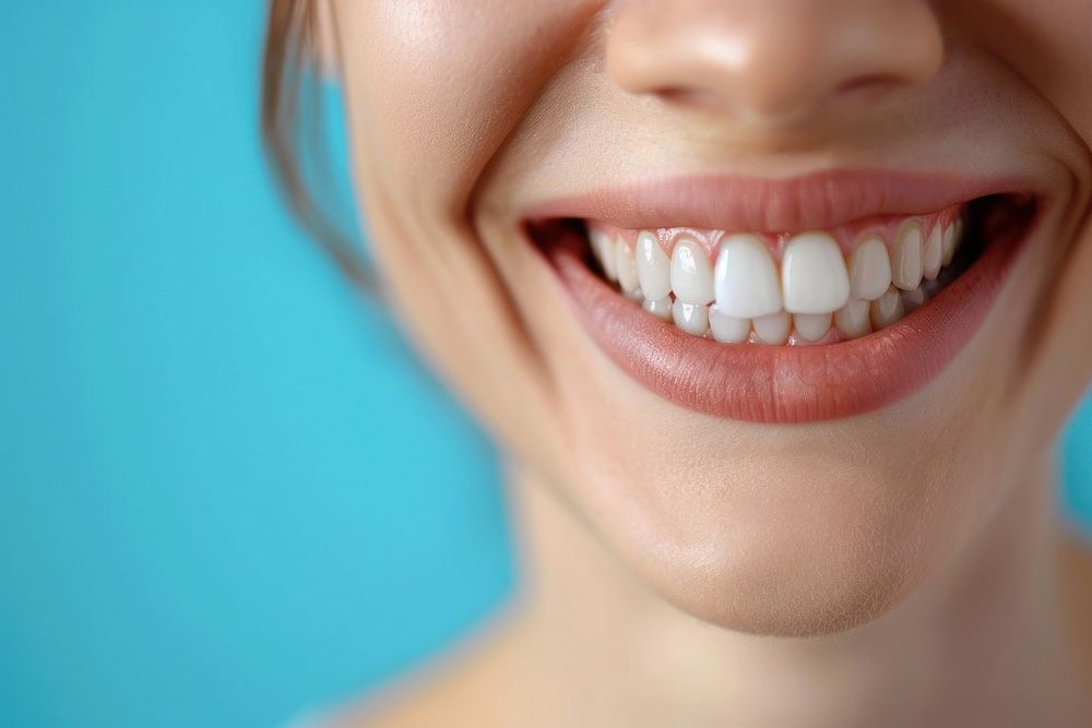 Women showing beautiful white smile teeth adult blue.