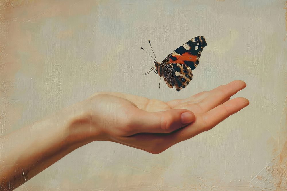 Oil painting of on pale hand holding a butterfly animal insect finger.