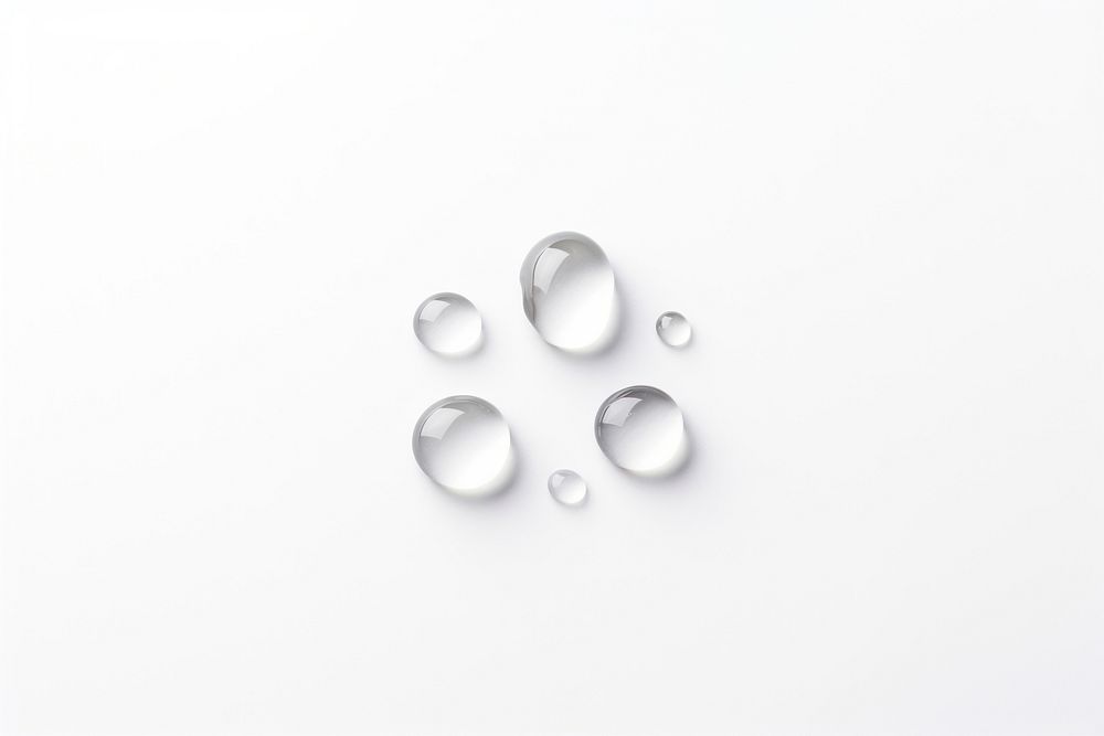 Water drops jewelry pill white background.