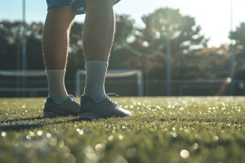 Soccer footwear standing outdoors.