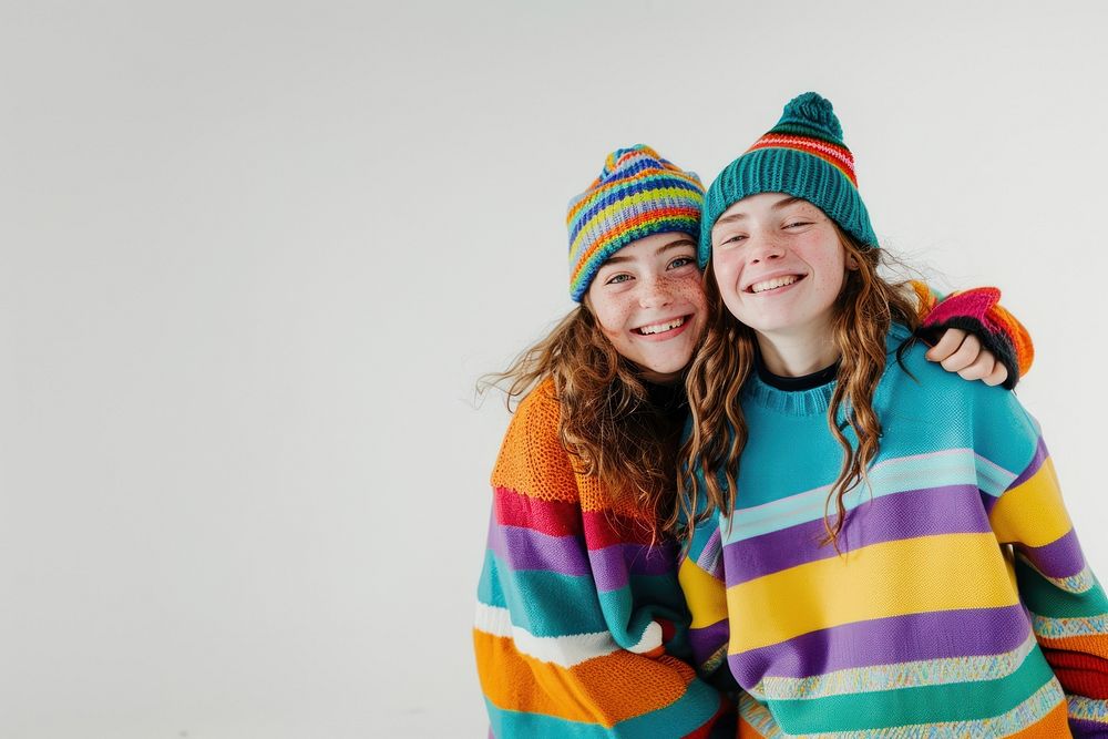 2 girls wear beanie portrait smile laughing.