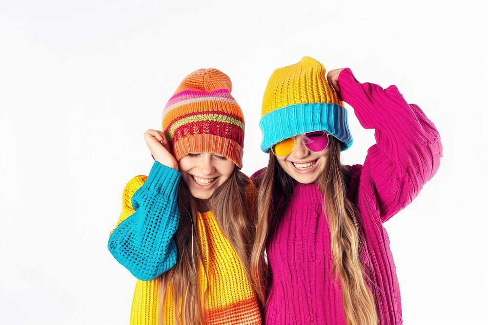 2 girls wear beanie sweater portrait scarf.