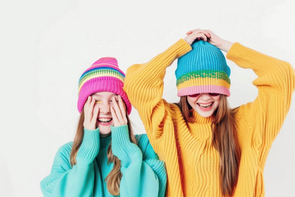 2 sisters wear beanie sweater laughing portrait.