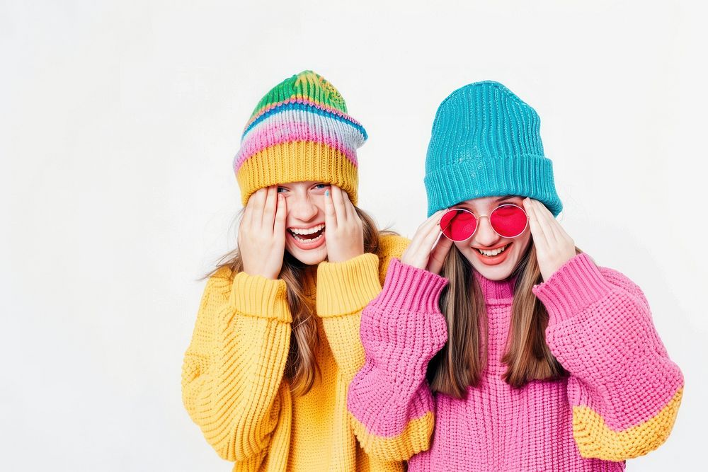 2 sisters wear beanie sweater laughing portrait.
