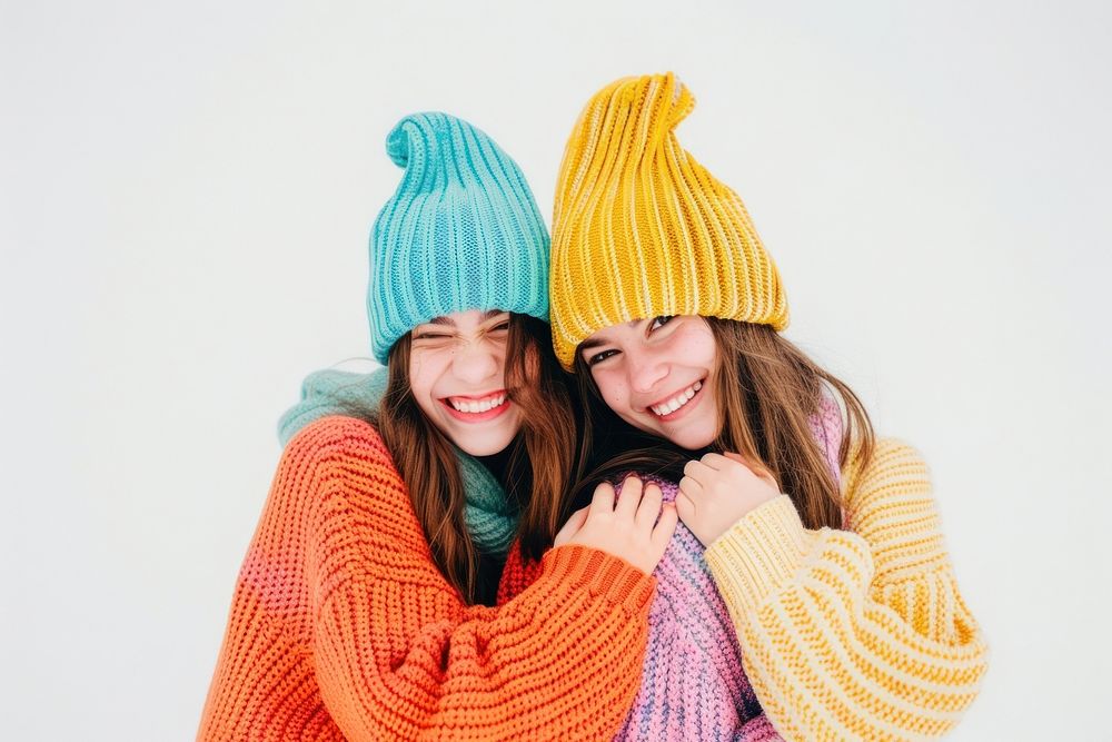 2 sisters wear beanie sweater portrait smile.