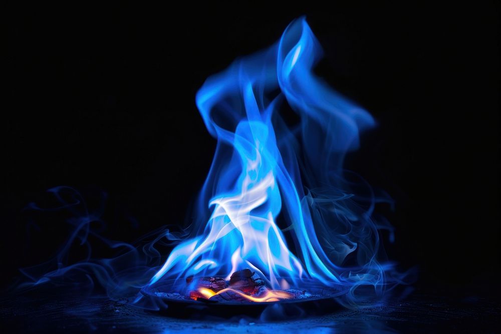 Coffee fire flame bonfire blue black background.