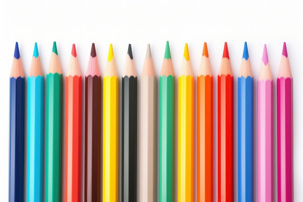 Colored pencils laying in row backgrounds order white background.