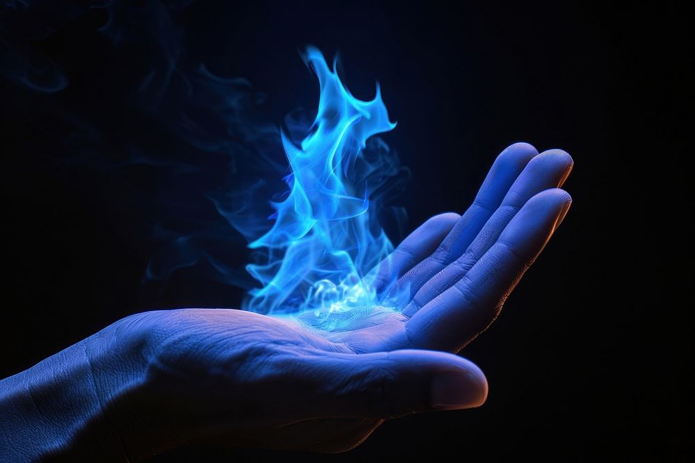 Hand fire flame finger smoke blue.