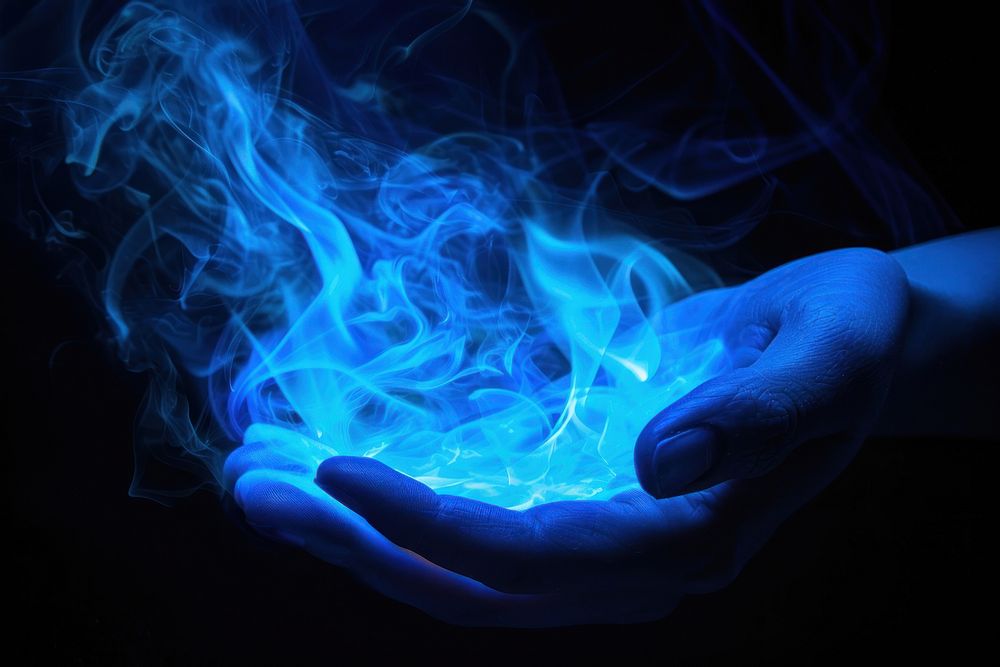 Hand fire flame light smoke blue.