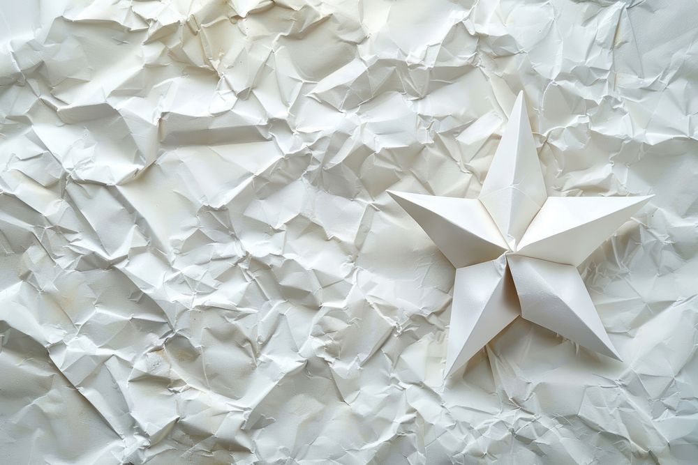 Star in style of crumpled paper backgrounds decoration.