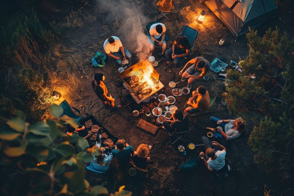 People party camping with BBQ grilling meat outdoors bonfire female.