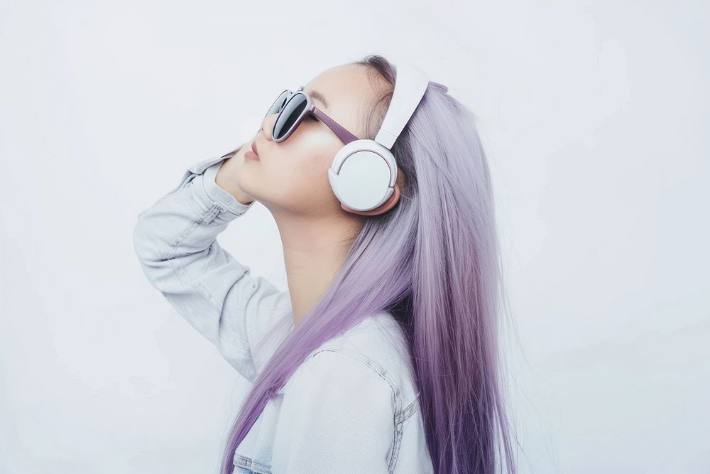 Teenage woman wear headphone purple headphones sunglasses.