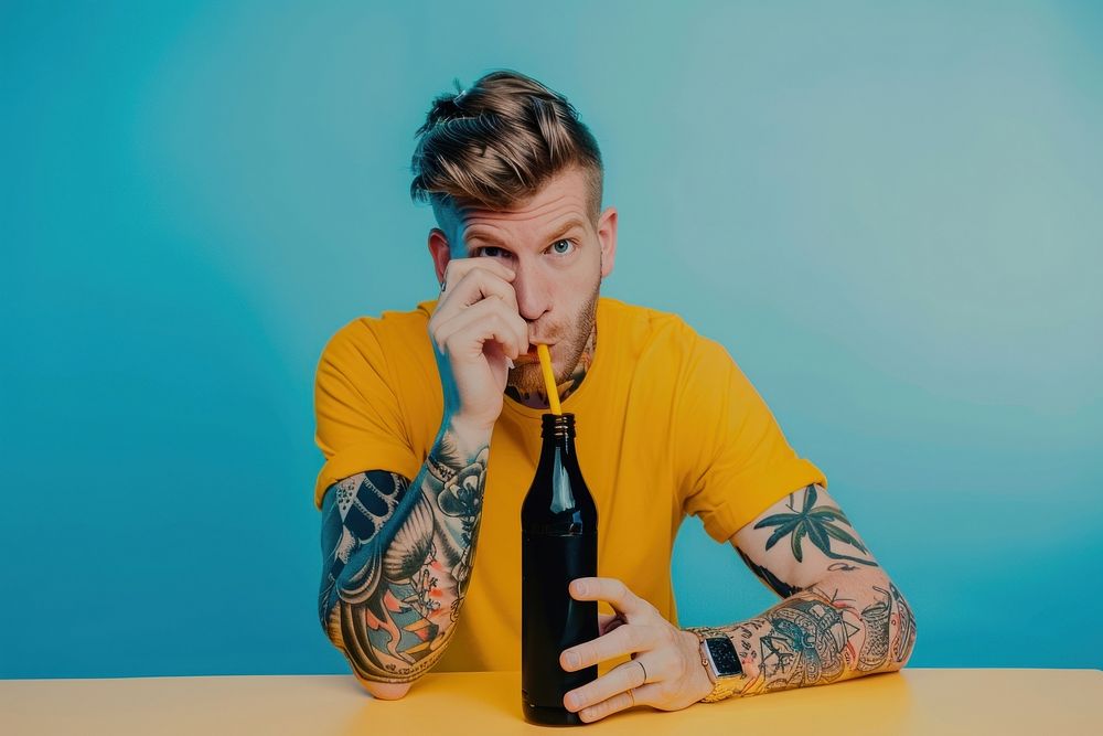 Teenage man straw bottle tattoo portrait drinking.