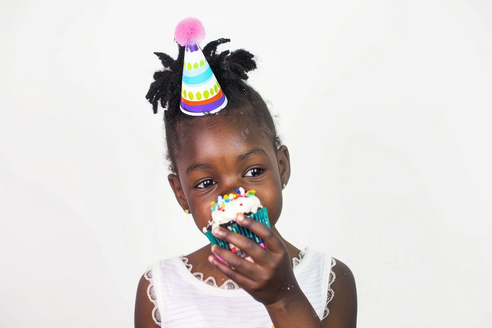 African girl eatting cupcake portrait birthday child.