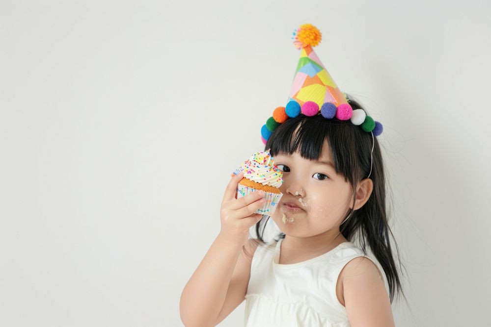 Asia girl eatting cupcake portrait birthday dessert.