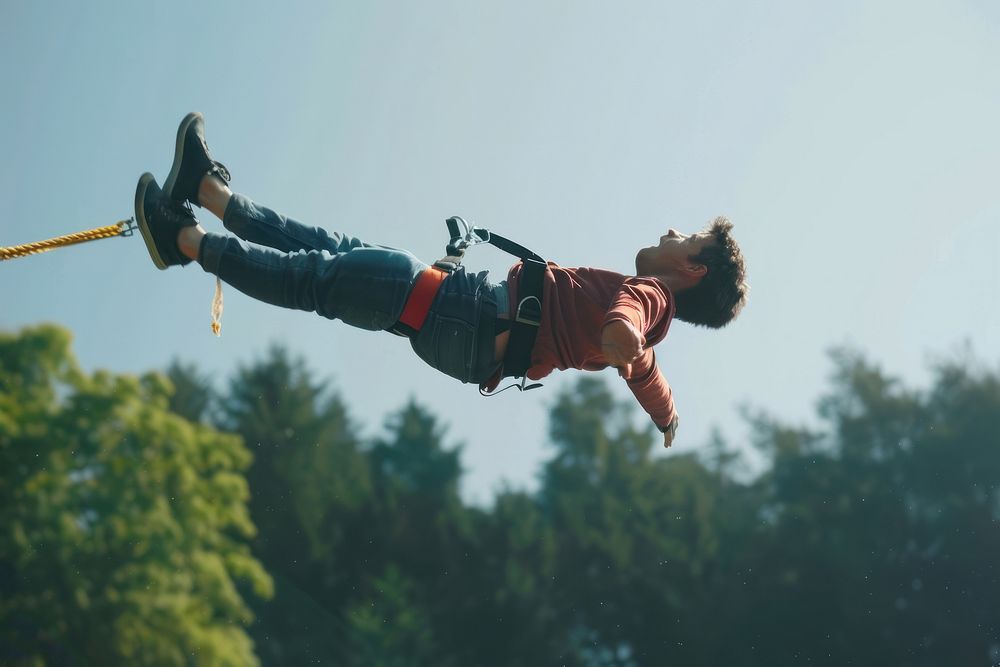 Man in bungee jumping recreation adventure outdoors.