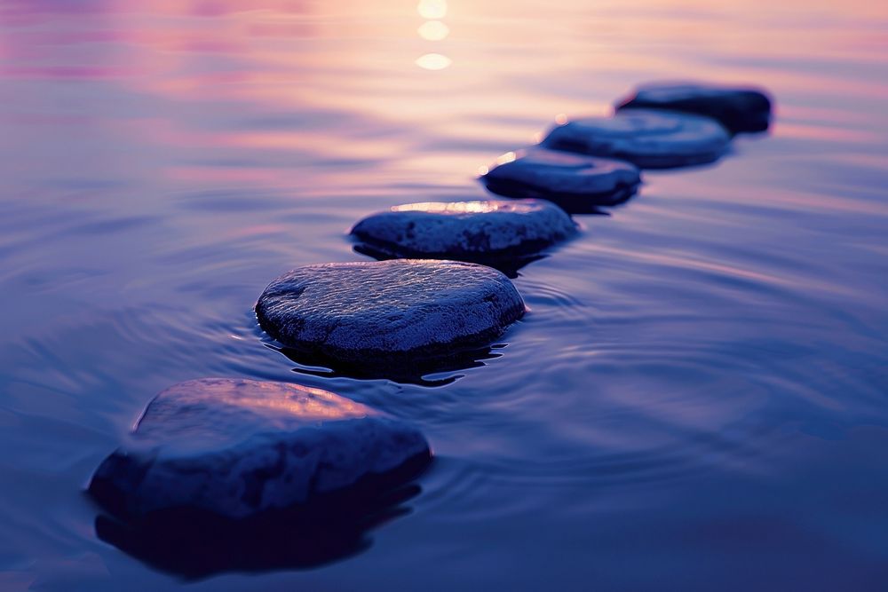 Stones on a waterline outdoors nature sunset.