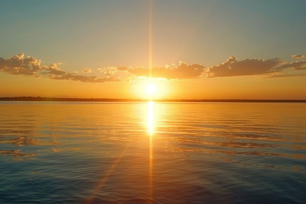 Sunrise lake landscapes sunlight outdoors horizon.