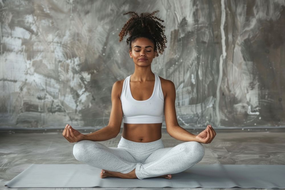 Wellness woman yoga meditating sitting sports.