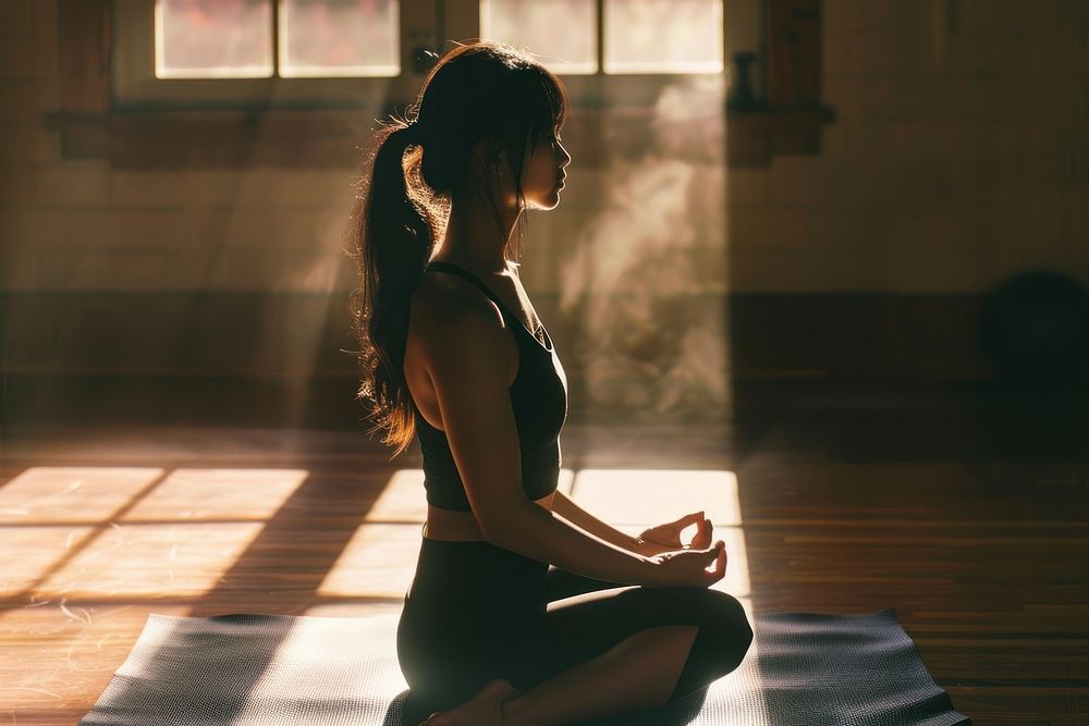 Asian woman practicing yoga sitting sports adult.
