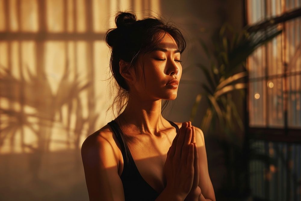 Asian woman practicing yoga adult contemplation spirituality.