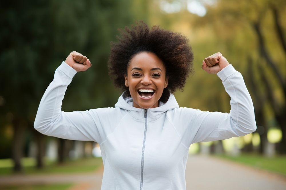 Black woman wearing white sport wear happy laughing person.