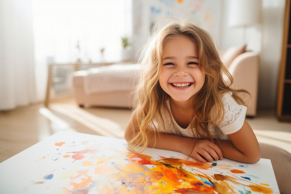 Girl painting with colorful gouache happy laughing person.