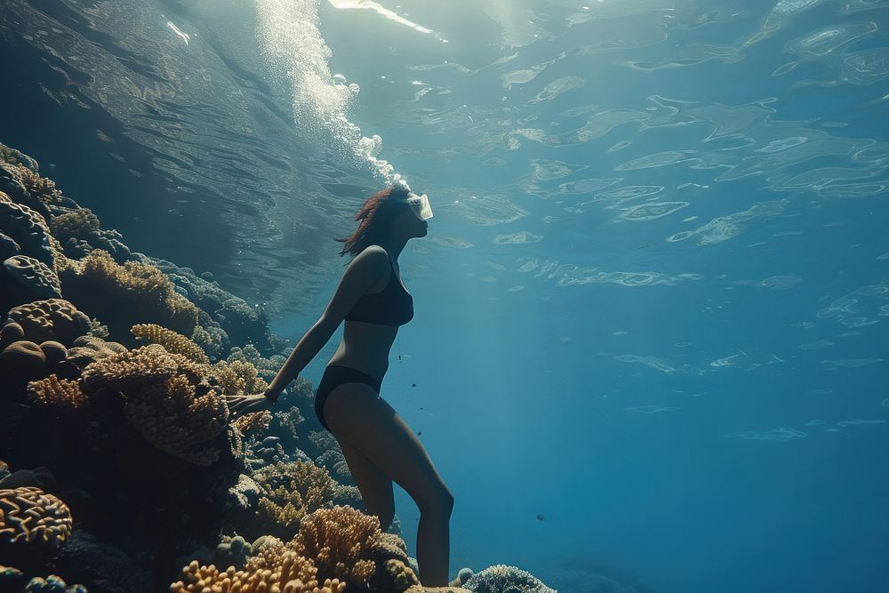 Free diver girl underwater outdoors clothing.