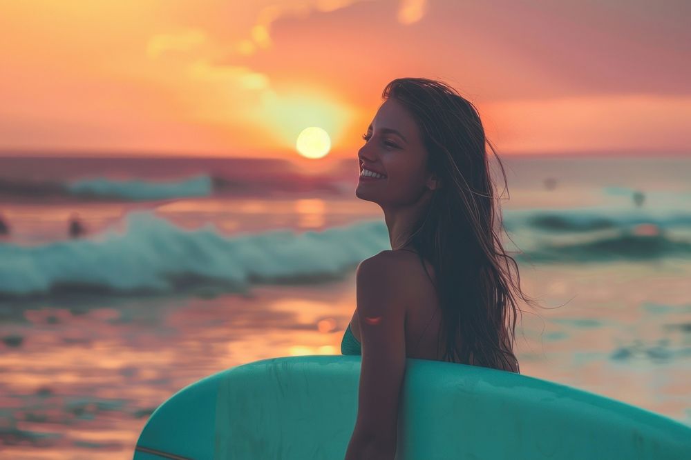 Surfer girl on the beach at sunset outdoors happy person.